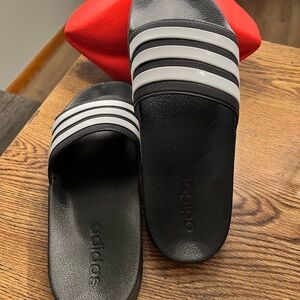 Black with white size 7 Adidas slide… New without box. Just too small